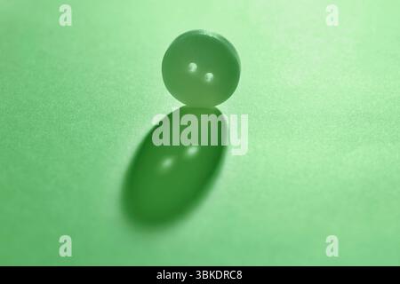 Green  button on green  background , abstract minimal background Stock Photo