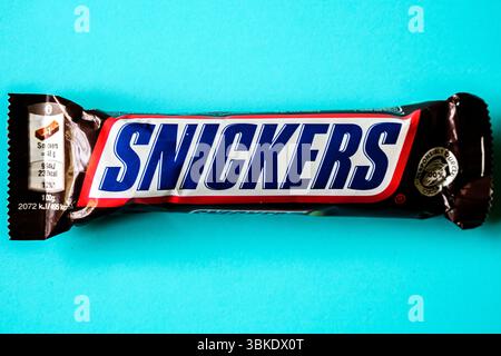 London UK, June 20 2025, Family Favourite Snickers Chocolate Bar With Caramel Peanuts And Nougat Covered In Milk Chocolate Stock Photo