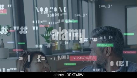 Bearded man and woman wearing casual attire reviewing code snippets in modern office, with plants Stock Photo