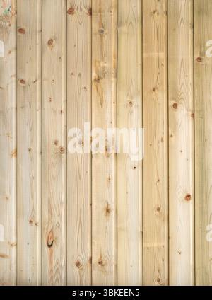 Rustic wooden wall, warm brown tones, vertical planks, natural grain, knots Stock Photo