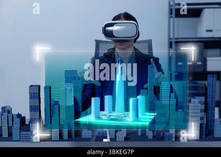 Building information modelling. Woman using virtual reality headset in office. holographic projection of city Stock Photo