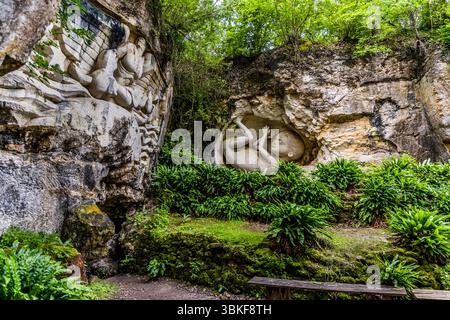 The Lapidales sculptures are carved into the rock of a former quarry by various artists and depict different figures and scenes. The works of art are part of the landscape and blend harmoniously into the natural surroundings. They are an example of the art and history of the region. Port-d'Envaux, Nouvelle-Aquitaine, France Stock Photo