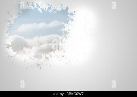 Splash on wall revealing clouds Stock Photo