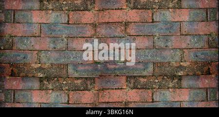 weathered brick wall is appearing in flat design, featuring red bricks with moss patches Stock Photo
