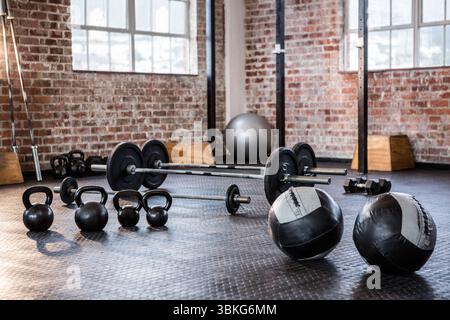 Warehouse-style gym equipment is being shown in flat design with kettlebells, barbells, plyo boxes Stock Photo