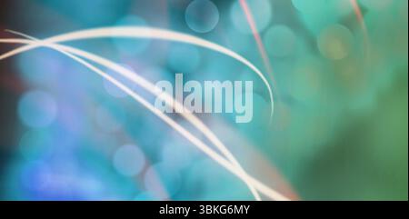 White light trails sweeping diagonally across abstract flat design, showing teal mint bokeh circles Stock Photo