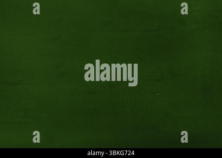Dark green textured surface is covering entire frame in flat design with subtle tone variations Stock Photo