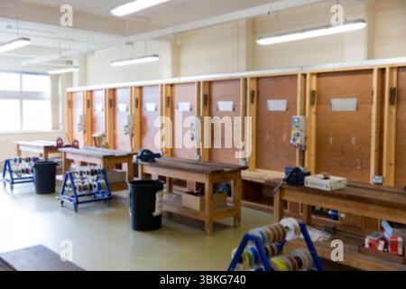 Flat design woodshop is showing benches with vices, wall-mounted tool stations, spool racks, bins Stock Photo