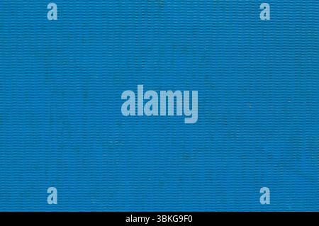 Blue textured rubber surface background close-up full frame. Stock Photo
