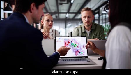 Scientist Using Supercomputer To Analyze Protein Molecule Structure In Lab. Stock Photo