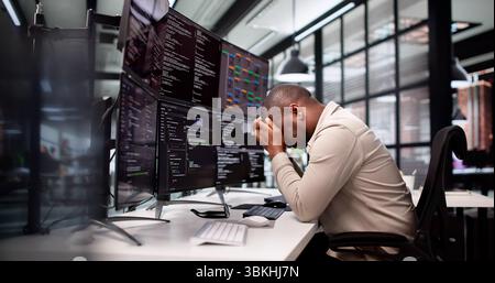 The Frustrated Programmer: A Sad Man Struggles With Software Development. Stock Photo