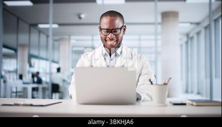 Smiling Black Psychiatrist Using Laptop In Medical Telehealth Consultation Stock Photo