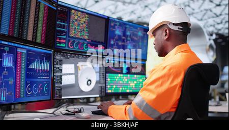 Young Engineer Developing Solar Panels Using 3D CAD Design Software. Stock Photo