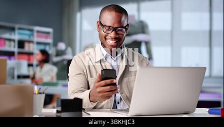 The Professional Designer Portrait Captures A Young African American Man Happily Working At His Tailor Fashion Atelier Stock Photo