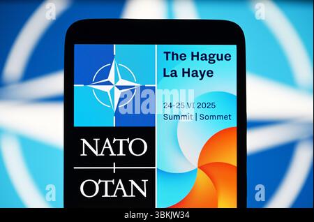In this photo illustration, the NATO Summit The Hague 2025 logo is seen on a smartphone screen. The NATO 2025 The Hague summit is an upcoming meeting of the members of the North Atlantic Treaty Organization (NATO) and their partner countries, which will be held in The Hague, Netherlands, on 24–25, June 2025. Stock Photo