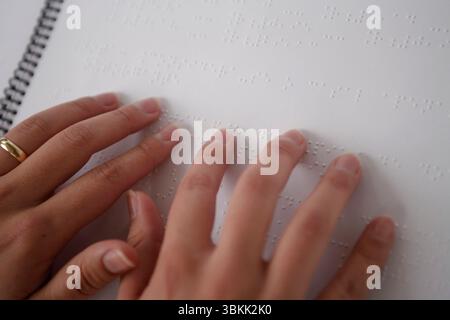 hands read the braille code Stock Photo