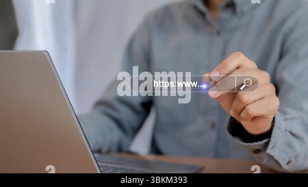 Businessman using laptop,searching for information on internet,search engine optimization with empty search bar Stock Photo