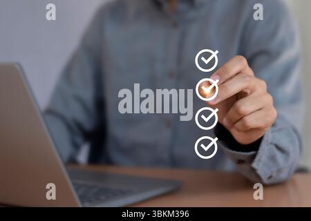 Businessman checks survey Performance checklist Fill out the digital form checklist Stock Photo