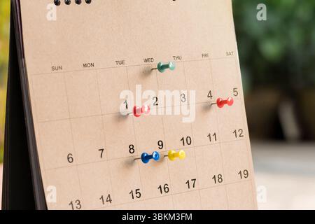 Embroidered pins on a calendar appointment appointment Stock Photo