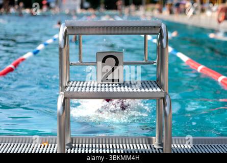 Cologne, Germany. 22nd June, 2025. The number two on the starting block at the edge of the stadium pool. Credit: Thomas Banneyer/dpa/Ģ����ý Live News Stock Photo