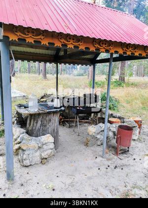 Rustic Garden Features A rustic outdoor cooking area features a traditional dome shaped clay ...