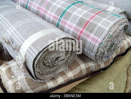 Rolls of linen fabric with a checkered pattern Stock Photo