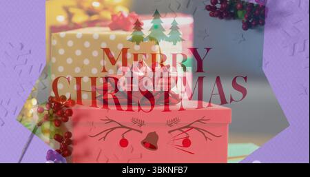 Displaying pink and polka-dot gift boxes on tabletop, with red ribbon and Merry Christmas graphic Stock Photo
