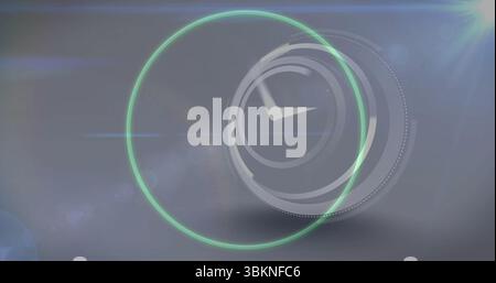 Displaying stylized clock face pulsing with green ring on grey gradient with light streaks Stock Photo