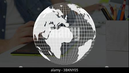 Hands hovering using stylus on tablet at desk, with floating wireframe globe colored pencil holder Stock Photo