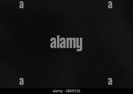 Pattern of synthetic black cloth background macro close up view Stock Photo