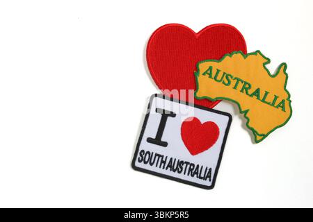 Embroidered “I LOVE South Australia” with red heart and map on right, white background, space left for text. Isolated handmade artwork. Stock Photo