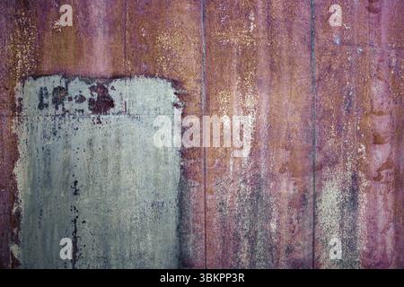 Rusty iron sheet with corrosion, selective focus, textured background Stock Photo