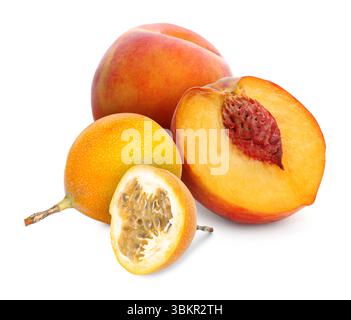Tasty ripe passion and peach fruits on white background Stock Photo