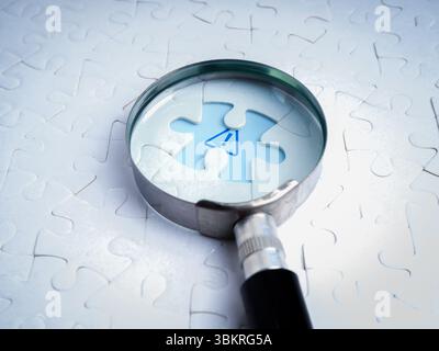Business solutions, problems found, problem solving concept. Close-up blue caution sign, graphic on space of last missing piece, focus in magnifying g Stock Photo