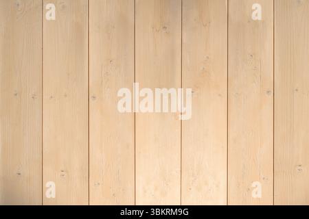 Vertical light-colored wooden planks are creating flat design backdrop showing subtle grain details Stock Photo