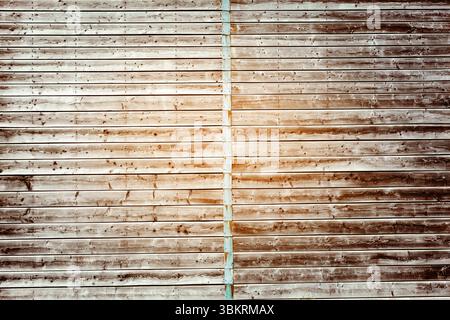Flat design showing weathered wooden wall with horizontal planks featuring central metal beam Stock Photo
