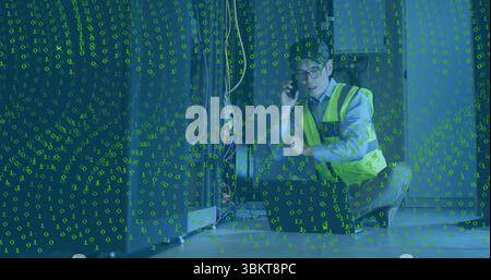 Technician calling on phone inspecting rack cables in server room with binary overlay, copy space Stock Photo