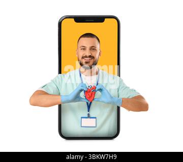 Male cardiologist looking out of smartphone screen on white background Stock Photo