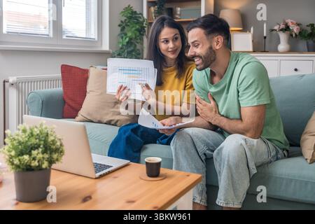 Successful young business people working together in home office. Freelance couple teamwork businessman and businesswoman startup concept video call p Stock Photo