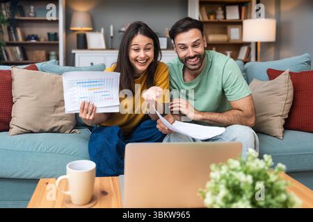 Successful young business people working together in home office. Freelance couple teamwork businessman and businesswoman startup concept video call p Stock Photo