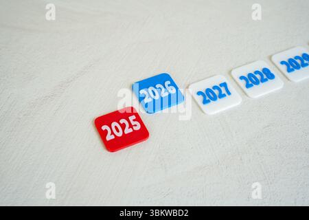End of 2025 and beginning of 2026. New Year. Business forecasts. Seasonal shifts, performance reviews, or strategic pivots. Competitive business envir Stock Photo