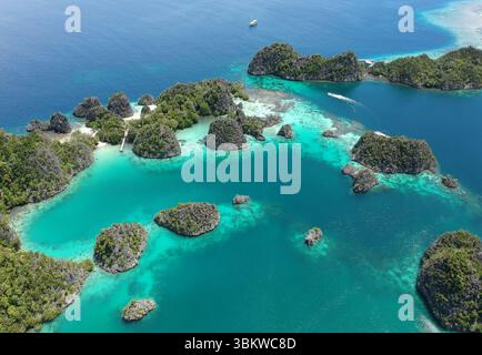 One of the most popular tourist destinations is Piaynemo in the Raja Ampat, West Papua Province. View of paradise islands from Piaynemo, one of the mo Stock Photo