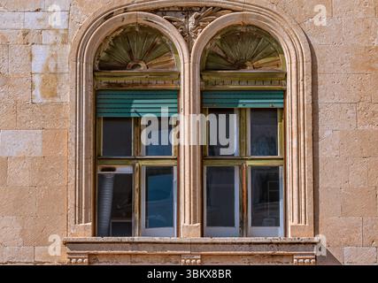 Croatia : An arch window with green shutters in Split Stock Photo