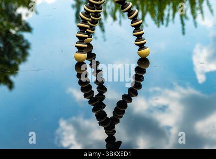 The sky reflected on a polished surface of a patio table. Stock Photo