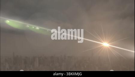 Streaking light beam forming starburst flare over buildings under clouds, lens flares, copy space Stock Photo
