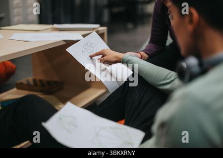 High school students engaged in collaborative classroom activity Stock Photo