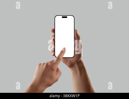 Man hand holding smartphone with blank screen and finger touch gesture on gray background. Perfect mockup for app design, UI testing, or mobile interf Stock Photo
