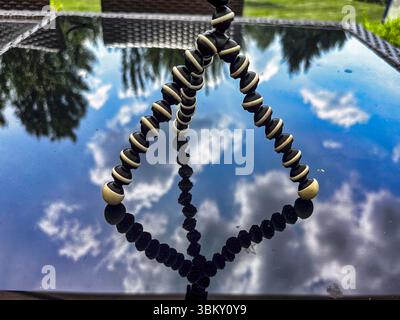 A mini tripod on a patio table. Stock Photo