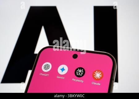 AI assistant apps ChatGPT, Gemini, Perplexity, and Claude displayed on smartphone in front of bold AI text. Stafford, United Kingdom, June 23, 2025 Stock Photo