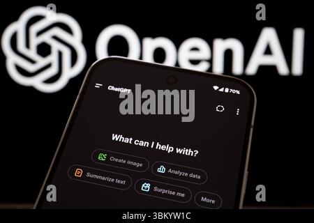 ChatGPT welcome interface on smartphone displaying options and OpenAI branding in background. Stafford, United Kingdom, June 23, 2025 Stock Photo